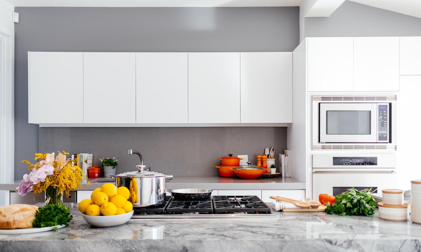 Organised kitchen and home storage with clean modern surfaces